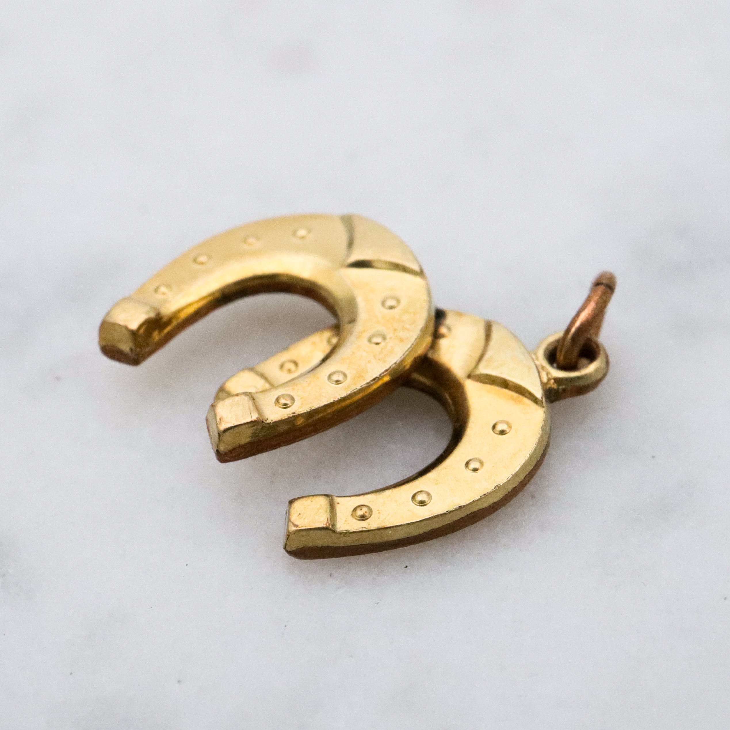 Antique rolled gold double horseshoe lucky charm pendant